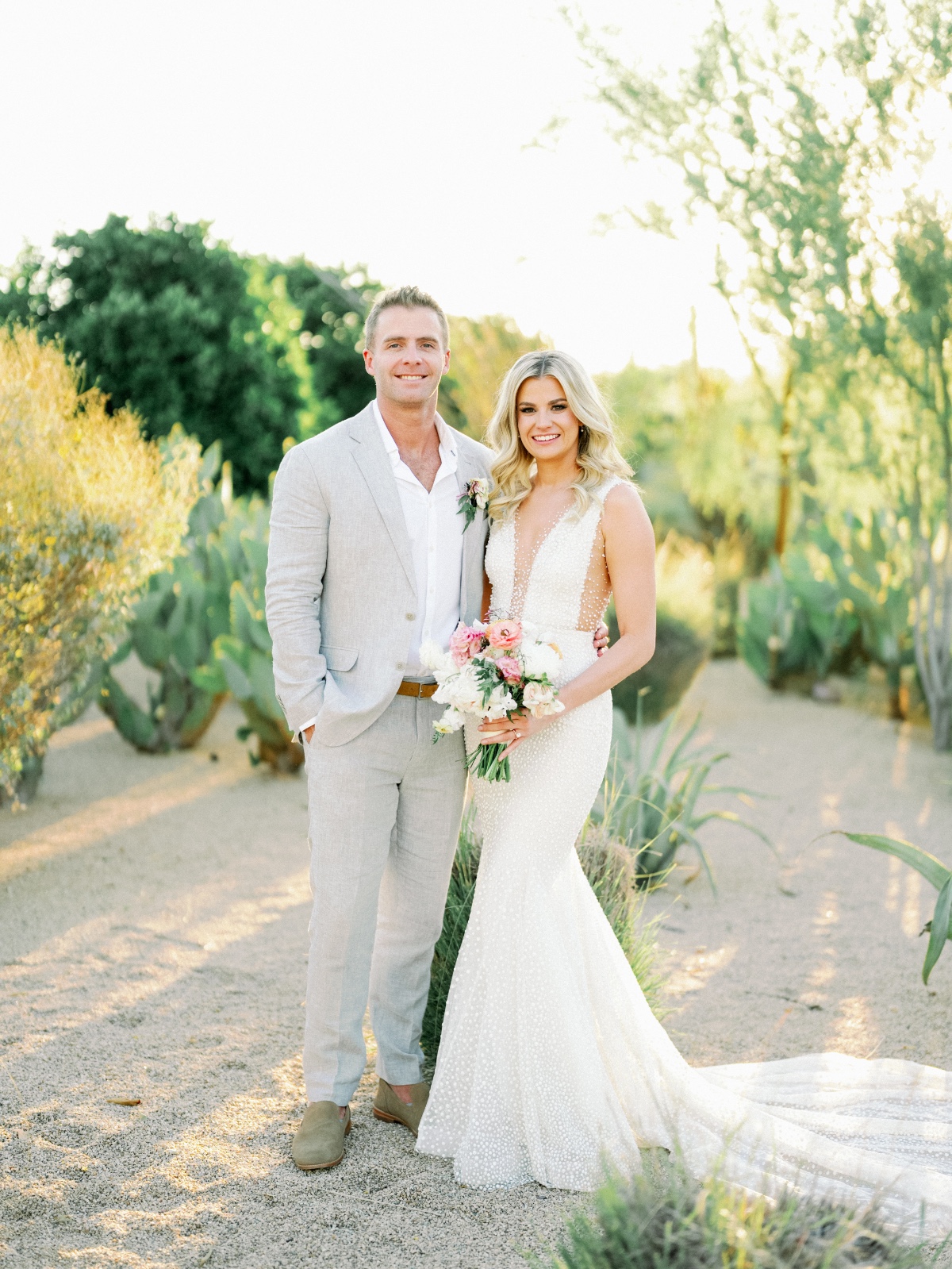A modern Arizona desert wedding draped in pastel blooms