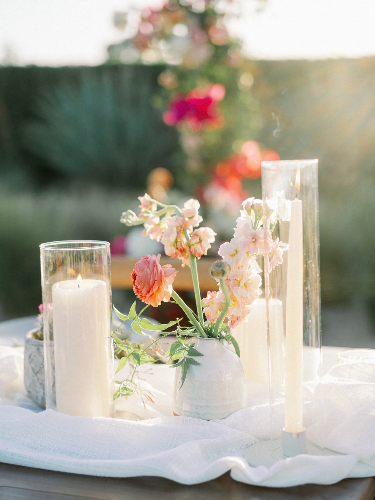 Dreamy pastel wildflower centerpiece with candles for reception 