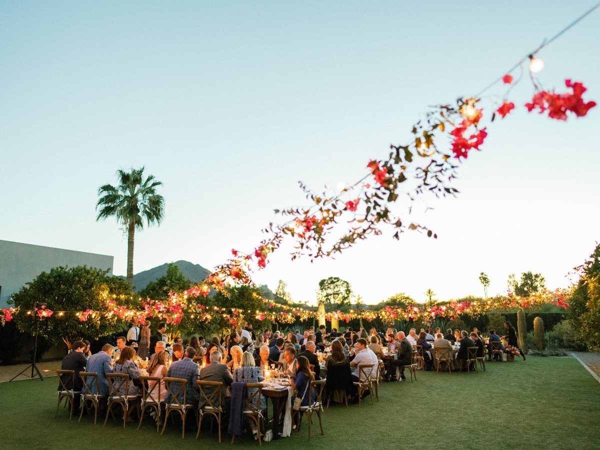 String light and pink floral filled wedding reception in Arizona