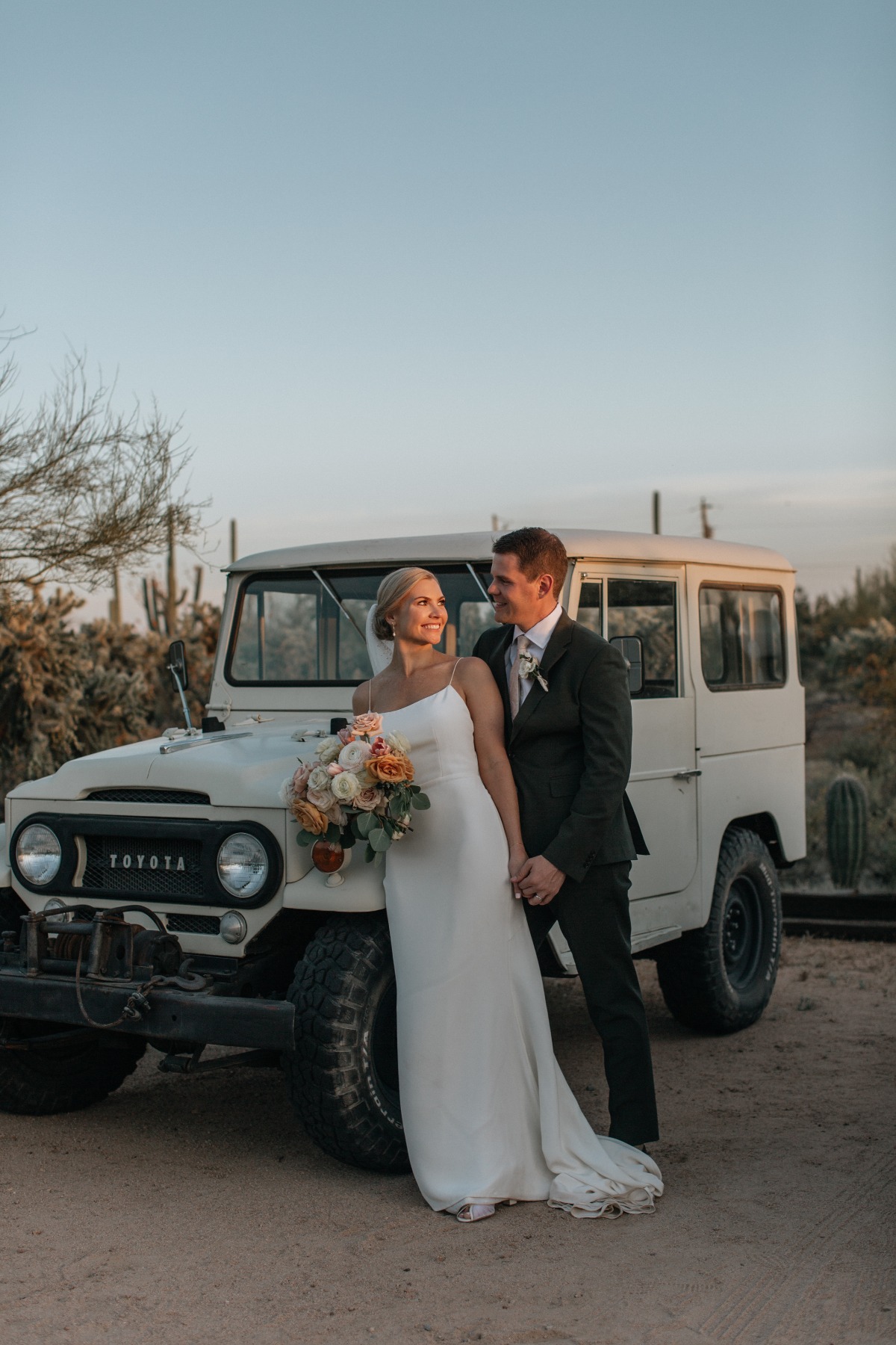 The couple rode off in a vintage Land Cruiser at their desert micro-elopement
