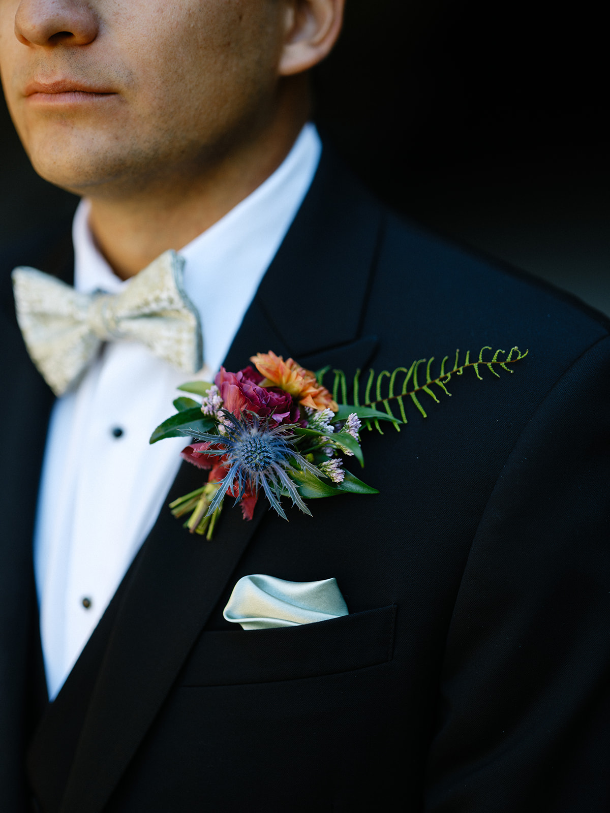 boutonniere with wildflowers and fern