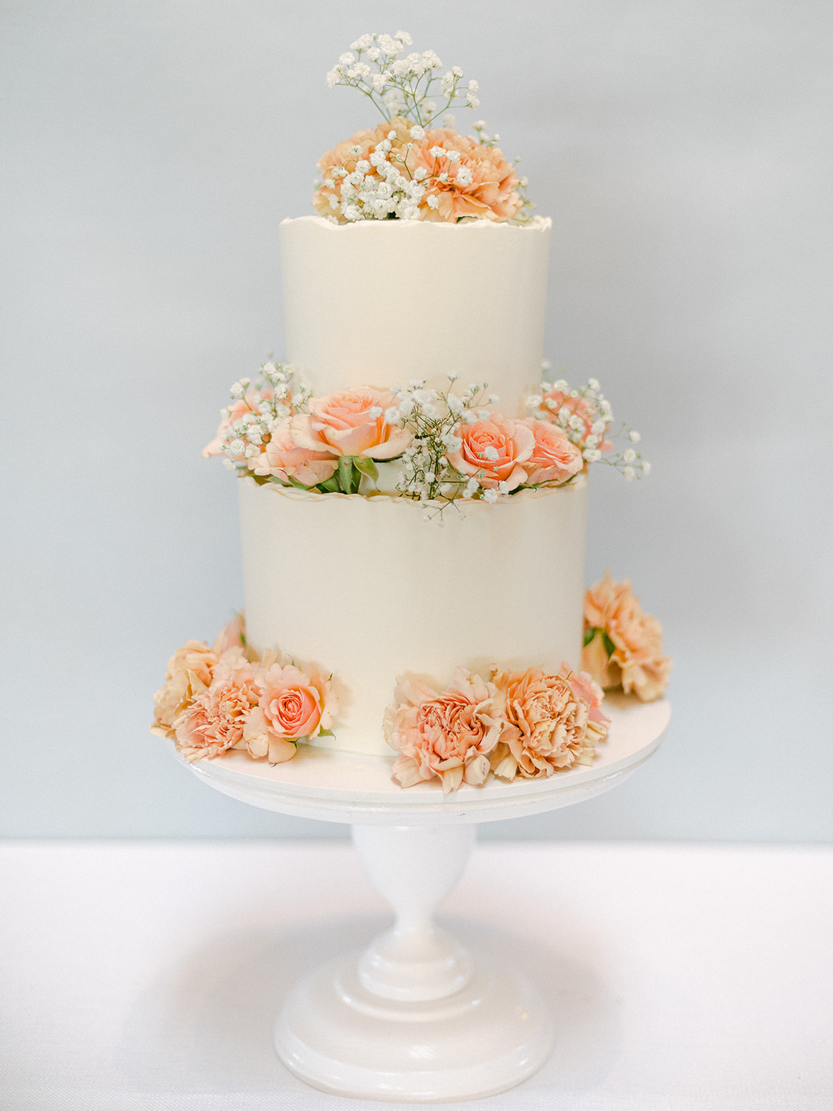 peach floral wedding cake