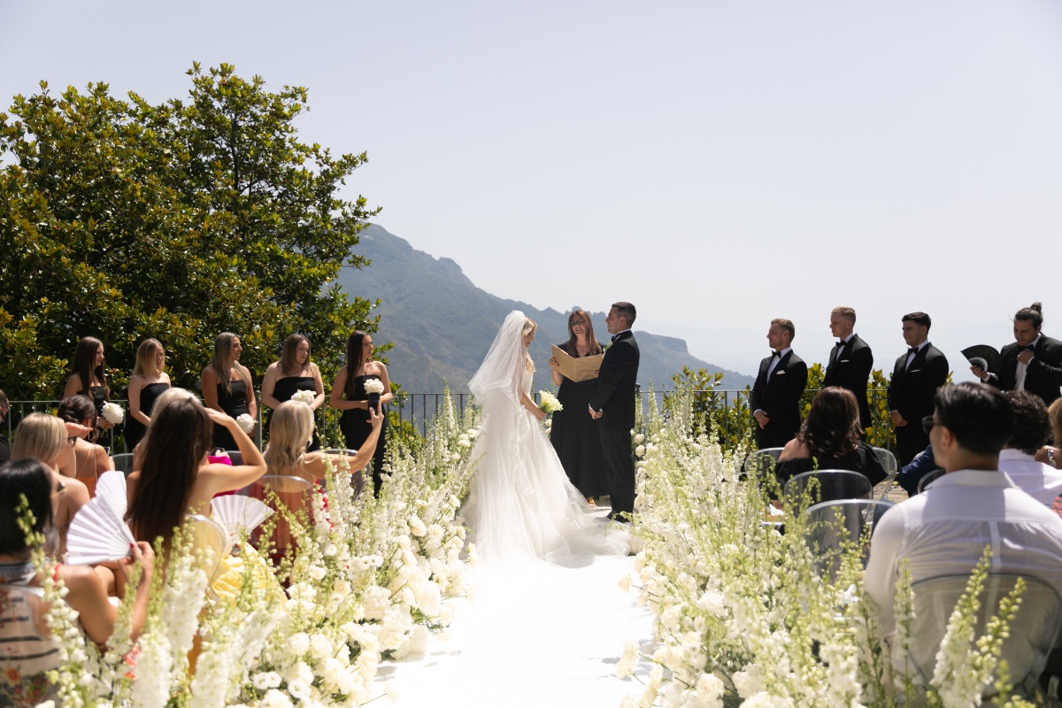 ceremony aisle lined with white flowers