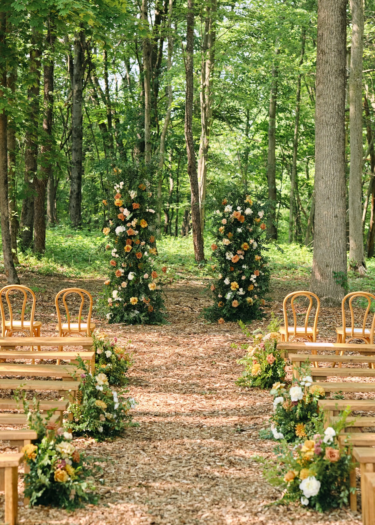 Orange and yellow floral desconstructed wedding arch 