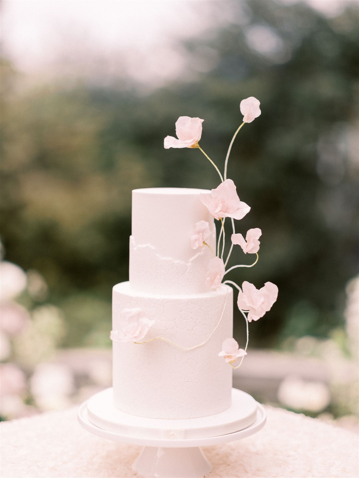 delicate floral accented wedding cake