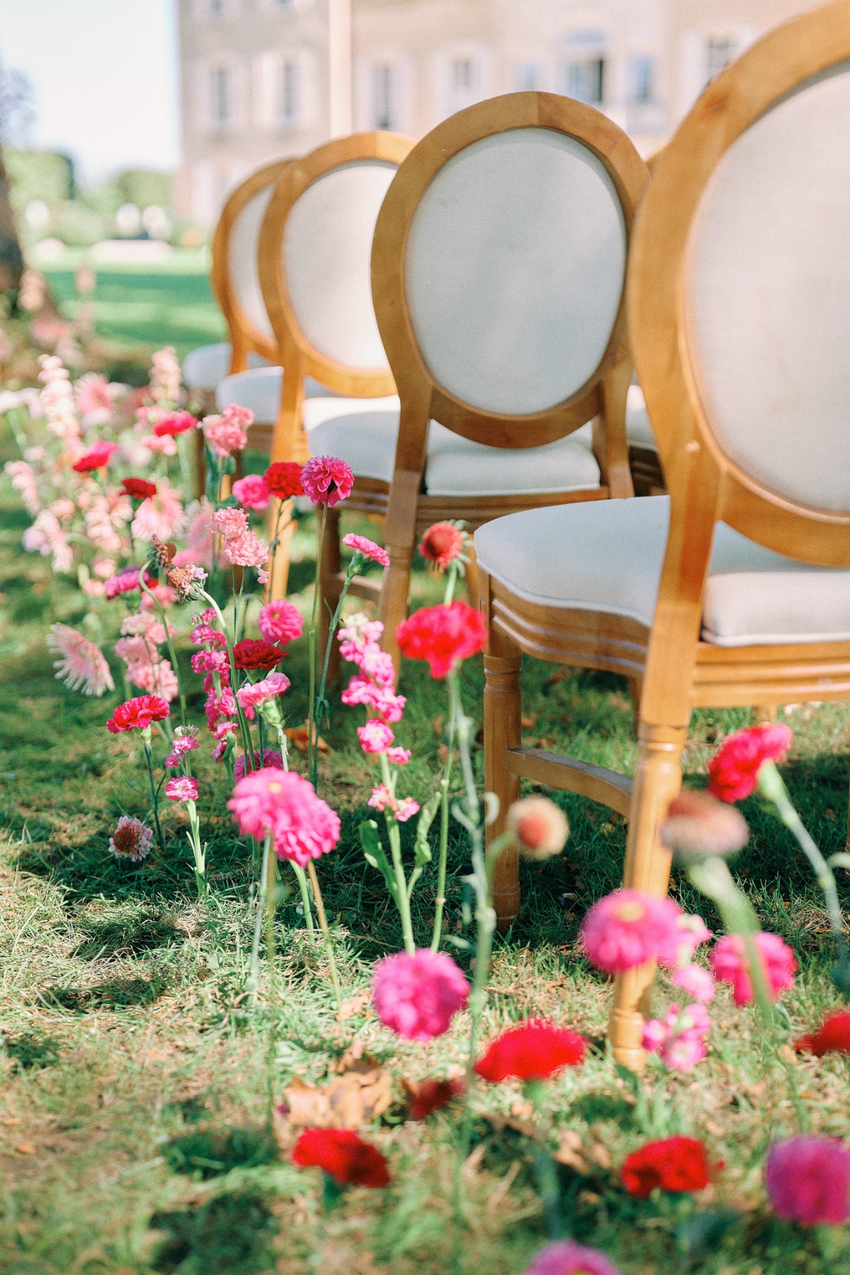 Bright pink floral stem runner for wedding ceremony