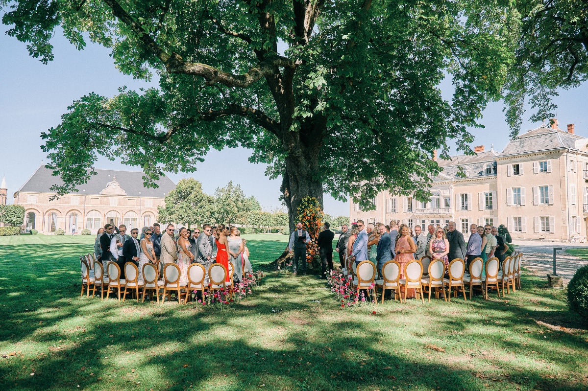 International wedding guests at outdoor chateau wedding 