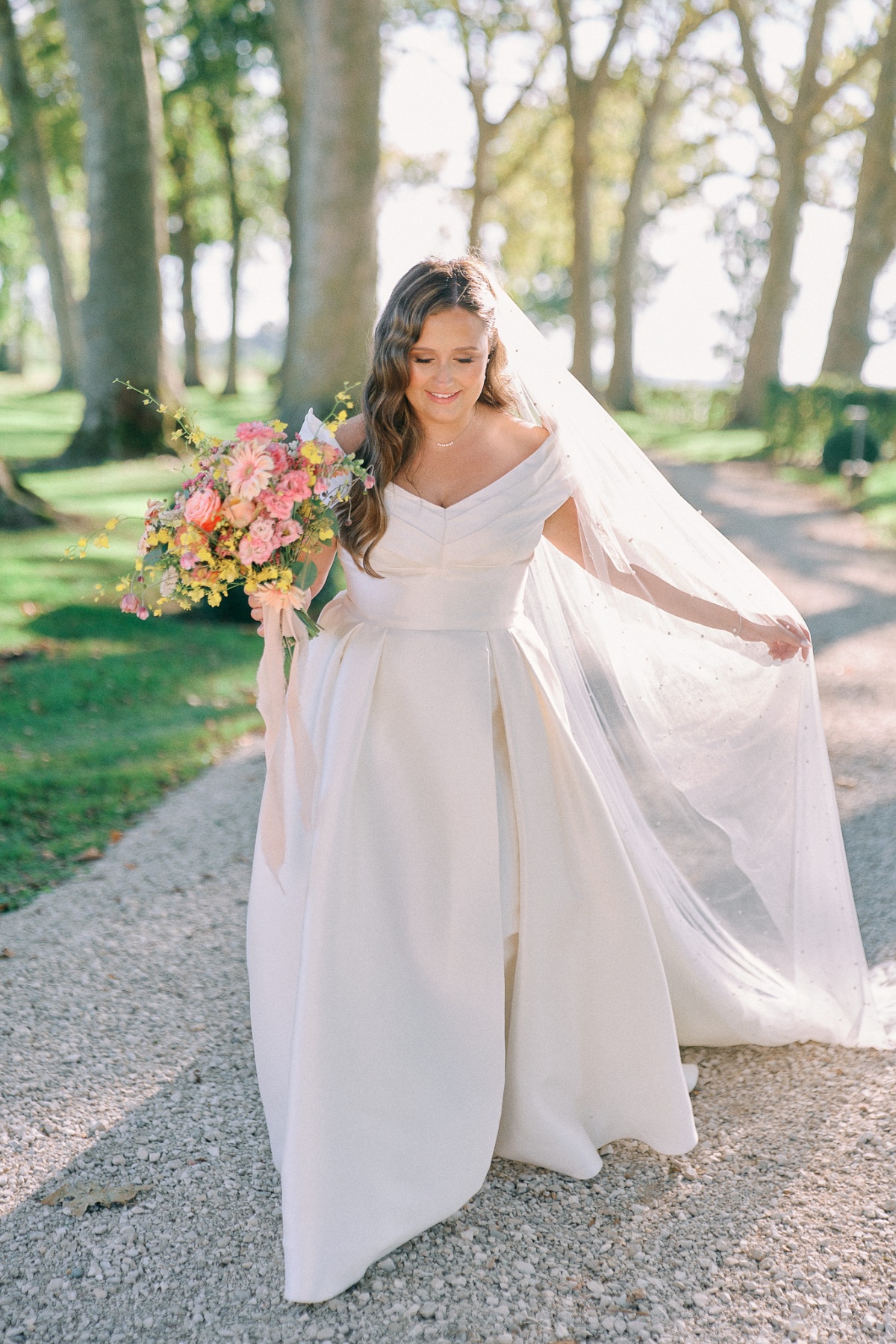 Timeless bride in France with pastel bouquet 