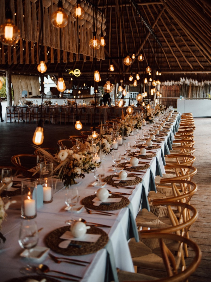 Upscale boho beach wedding in mexico with a macrame installation