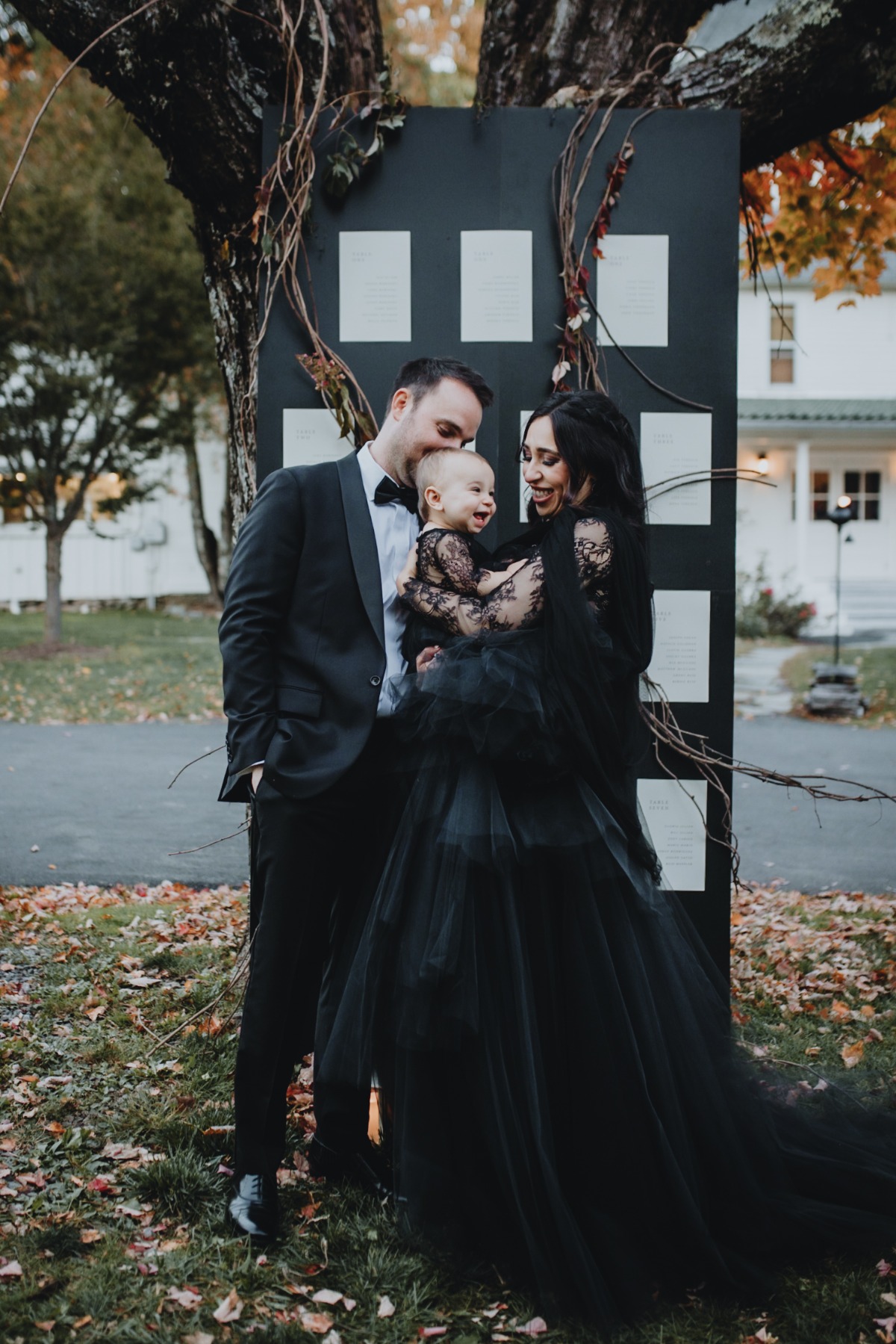 Bride and baby in matching black wedding dresses for fall 