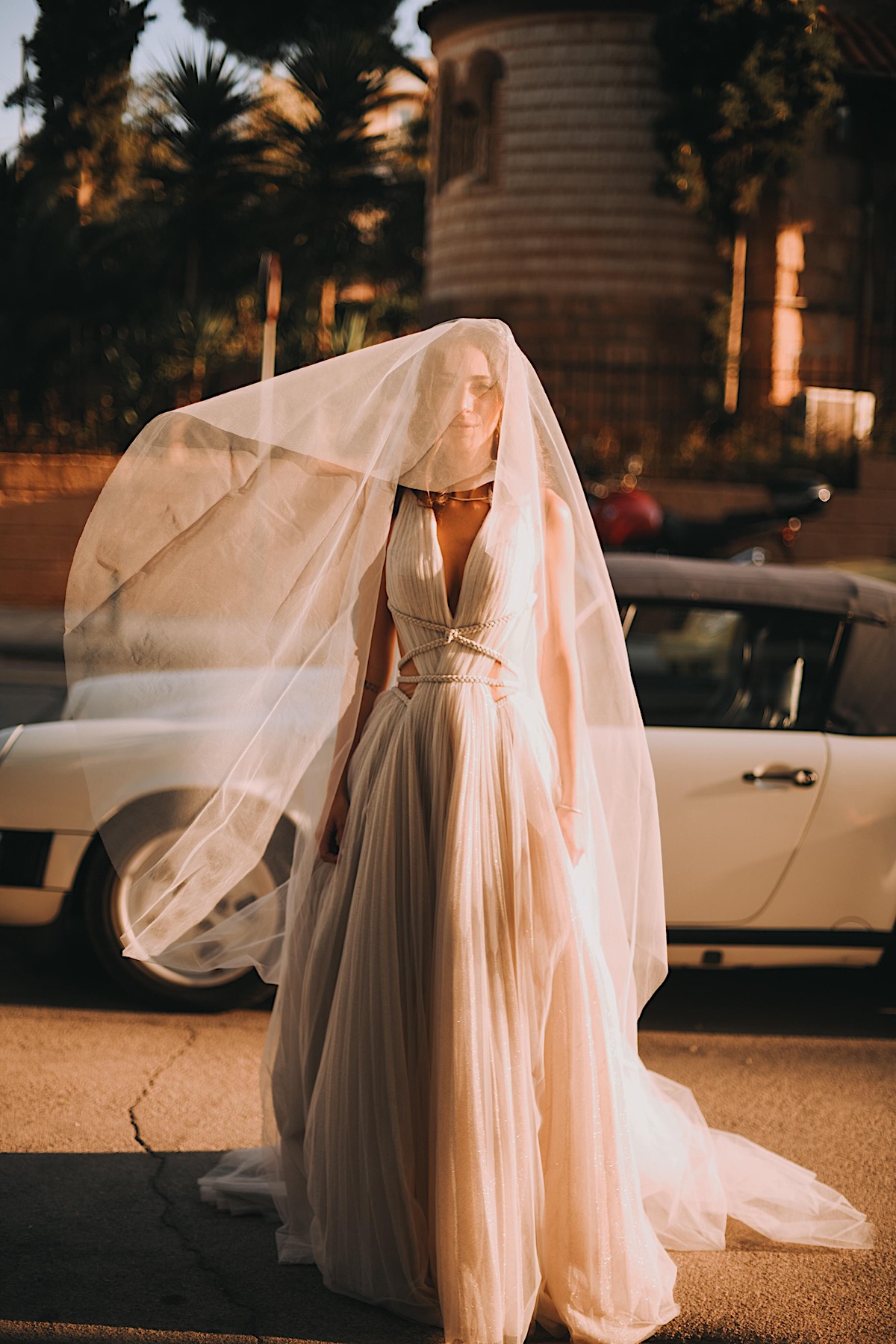Moody destination wedding bride in Greece with vintage car