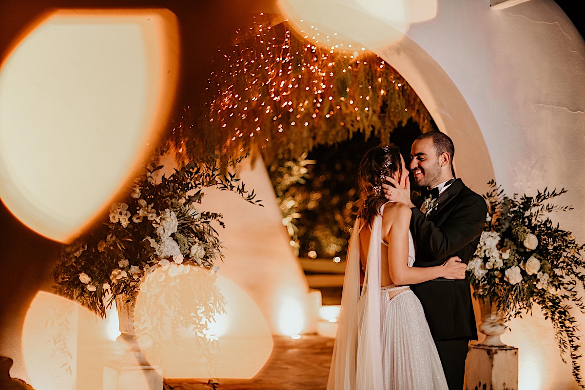 Romantic string light night wedding photography in Greece