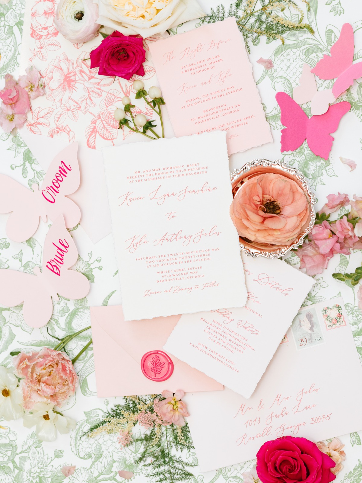 Elegant light pink and white wedding invitations in script