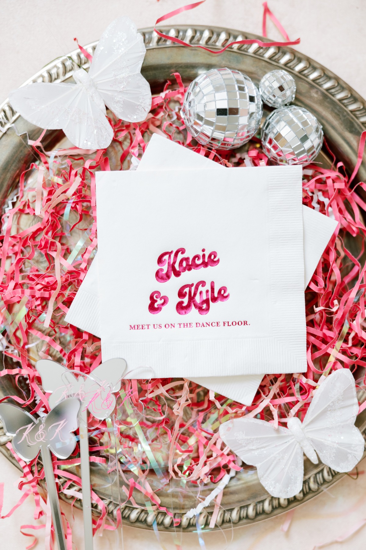 Custom cocktail napkins with iridescent pink welcome message