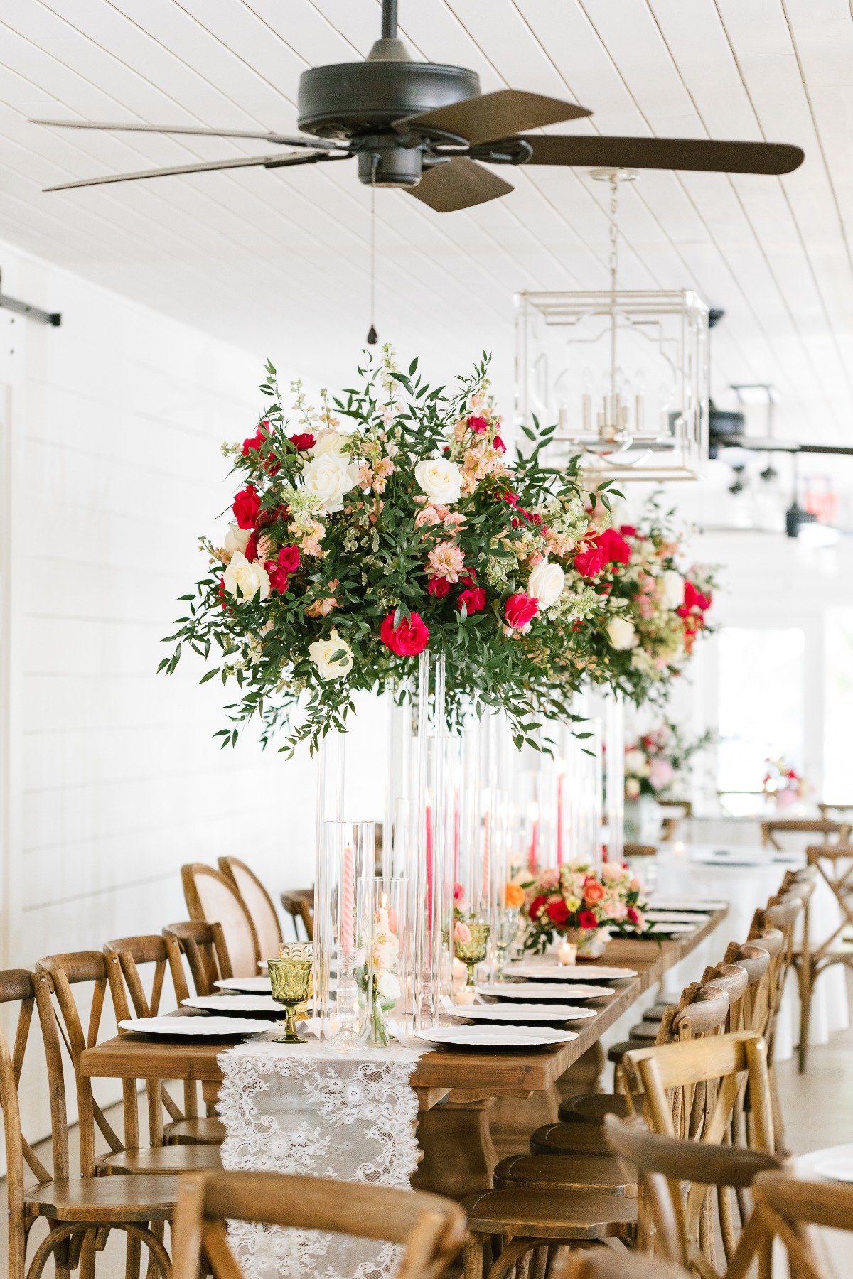 Pink pastel wedding reception with floating floral centerpieces