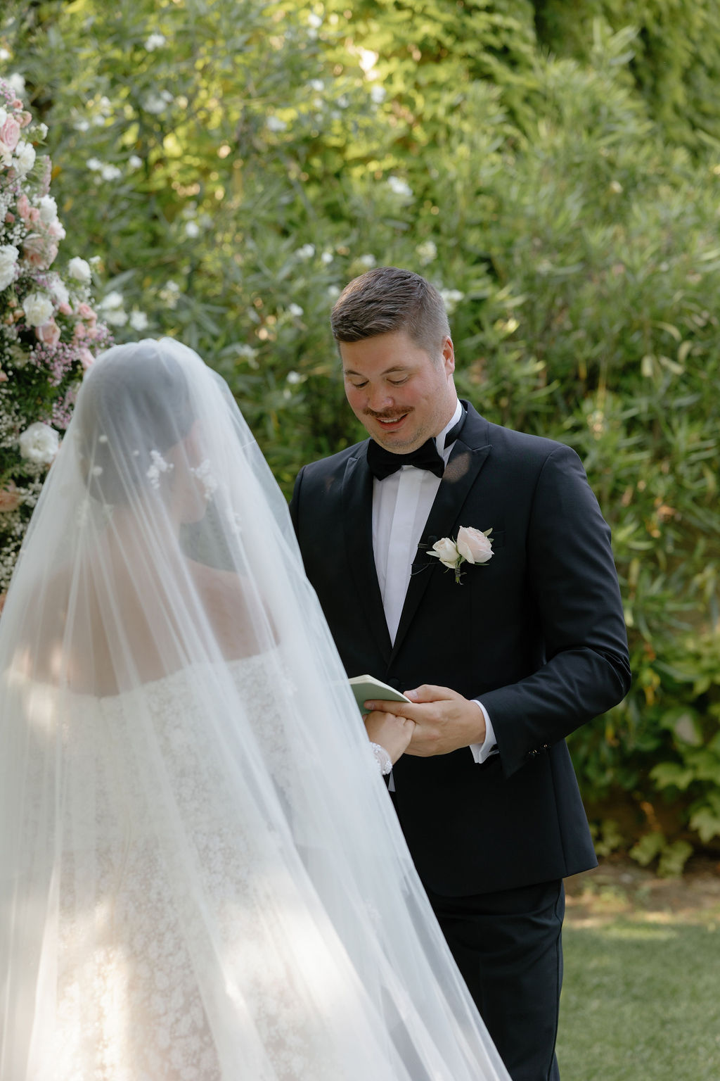 Groom reading vows at French destination wedding in Provence