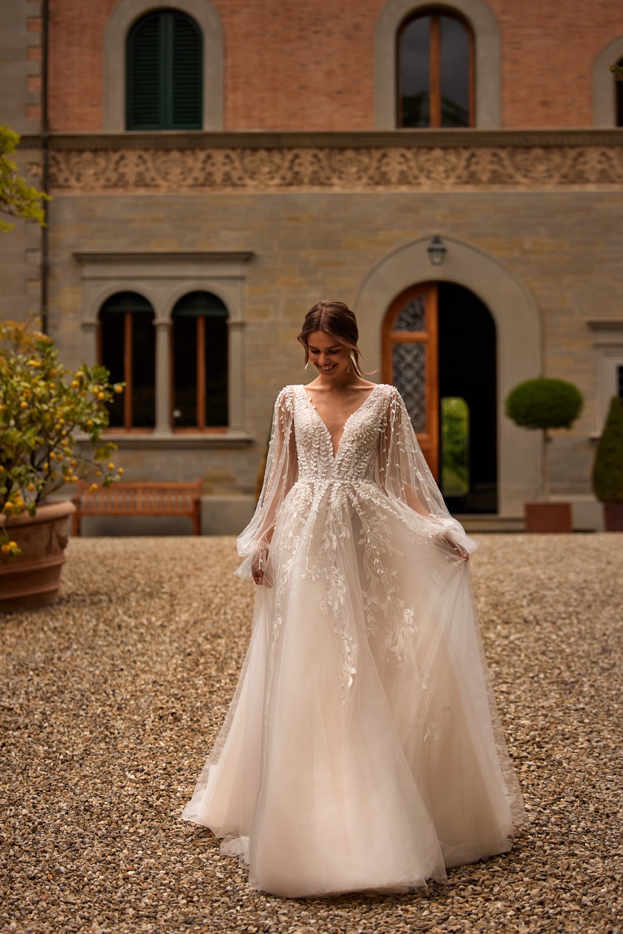 long sleeve tulle embroidered wedding dress by pollardi