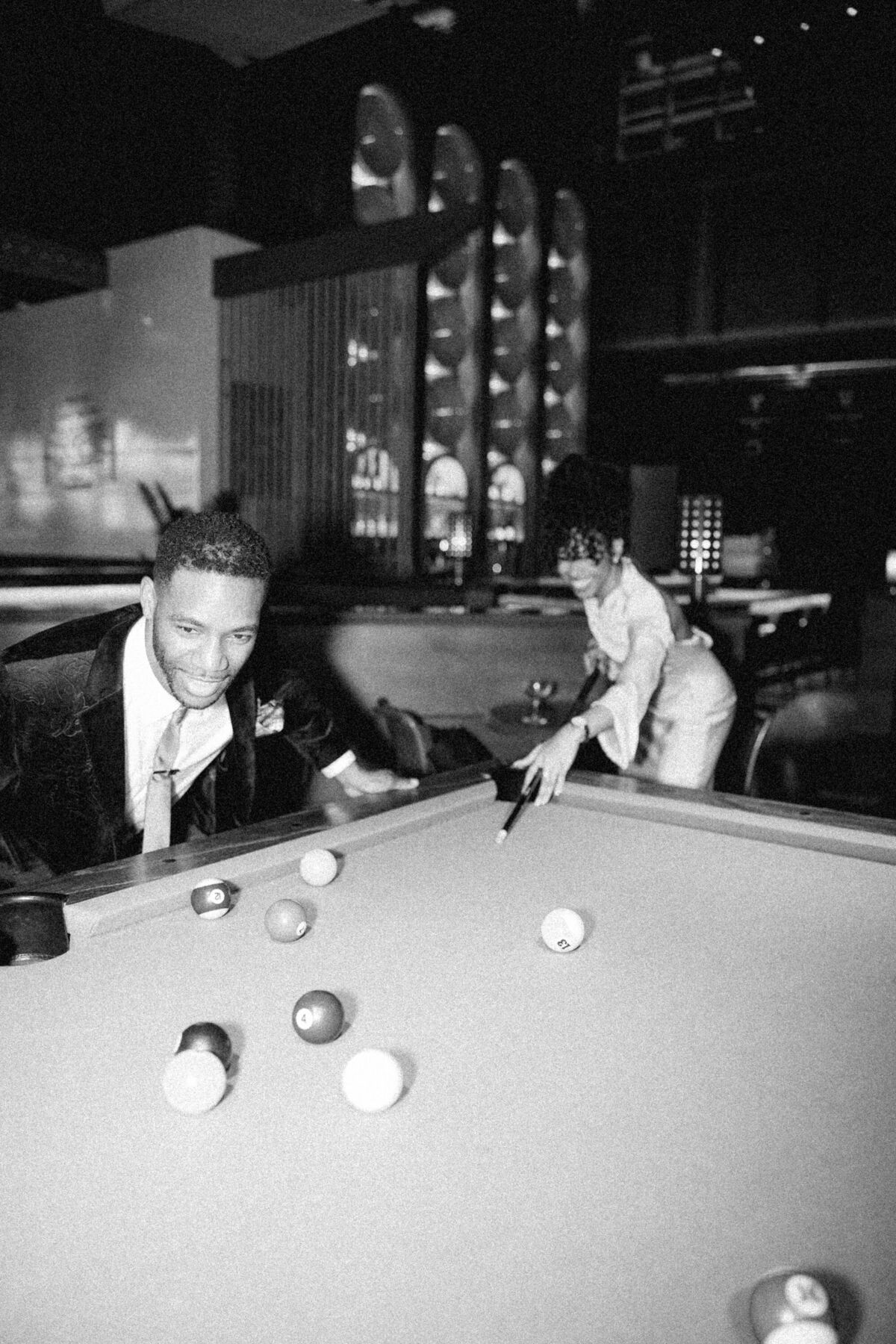 NYC couple playing pool 
