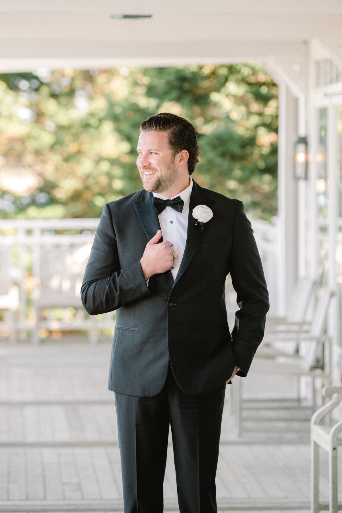 Timeless Cape Cod groom in classic black and white tuxedo