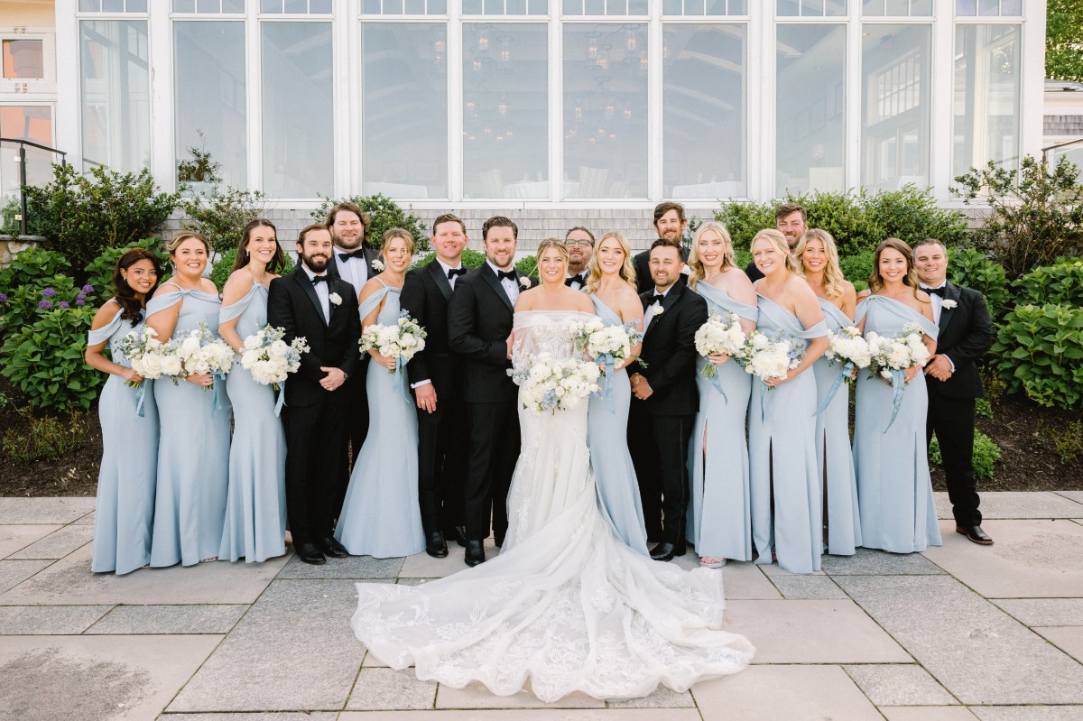 Timeless Cape Cod bridal party in pastel blue dresses and black tuxes