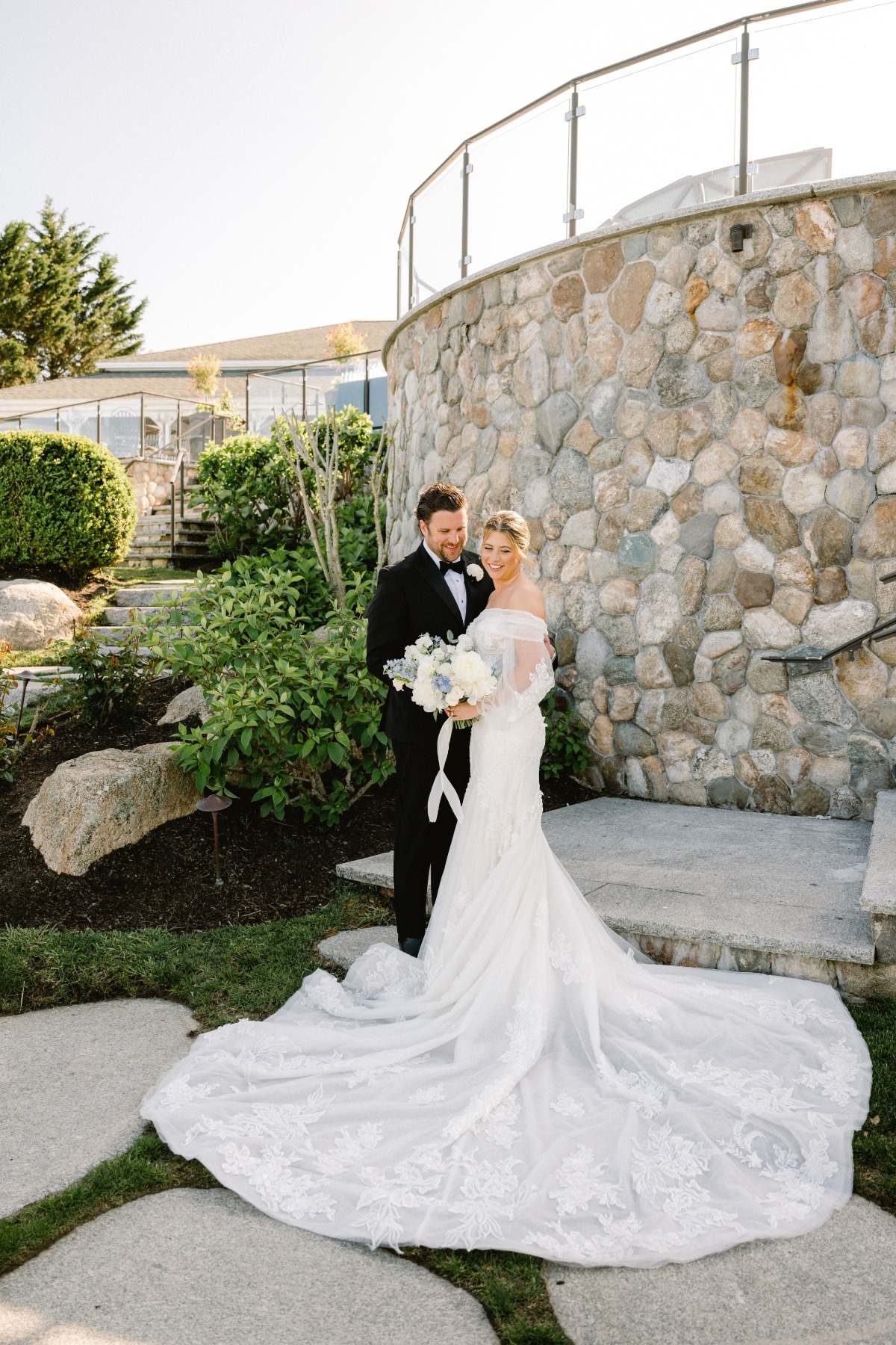 Luscious stone and greenery backdrop at Cape Cod wedding