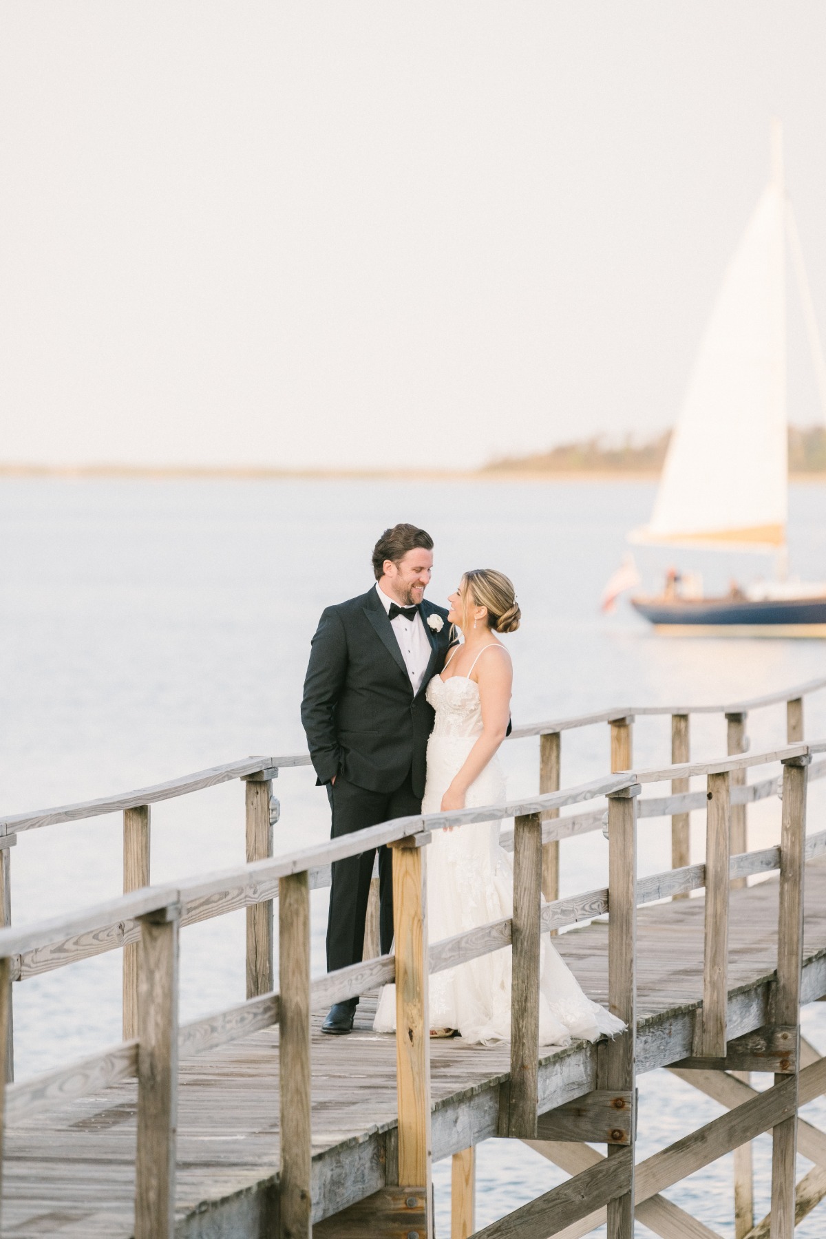 Cape Cod bride and groom sunset portraits on wooden pier