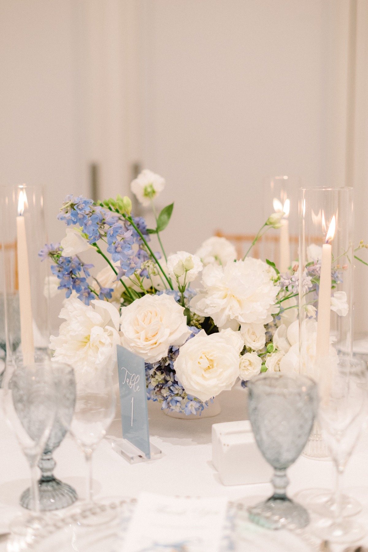 White and blue floral centerpieces for garden wedding