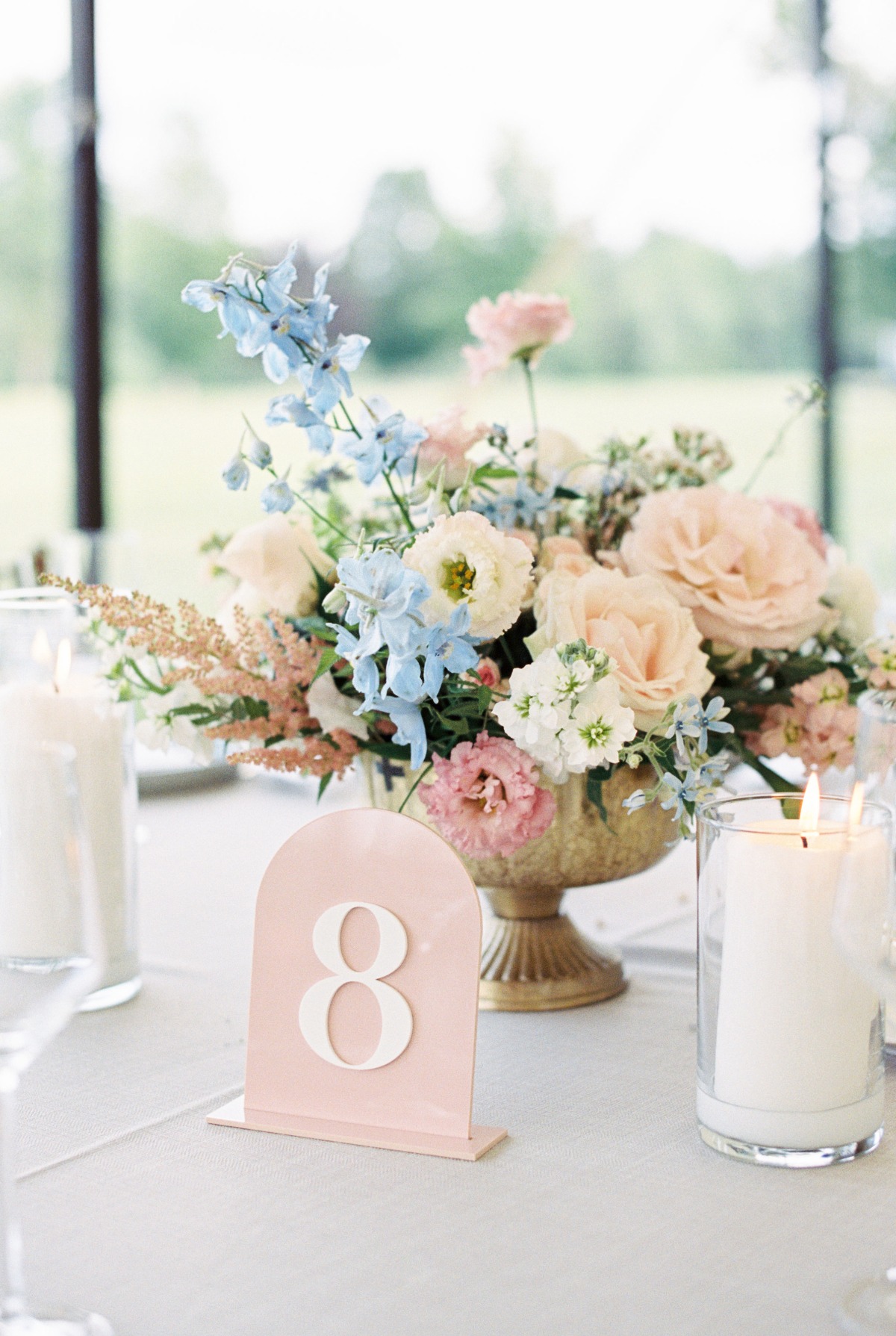 Pink and blue reception centerpiece with matching table number