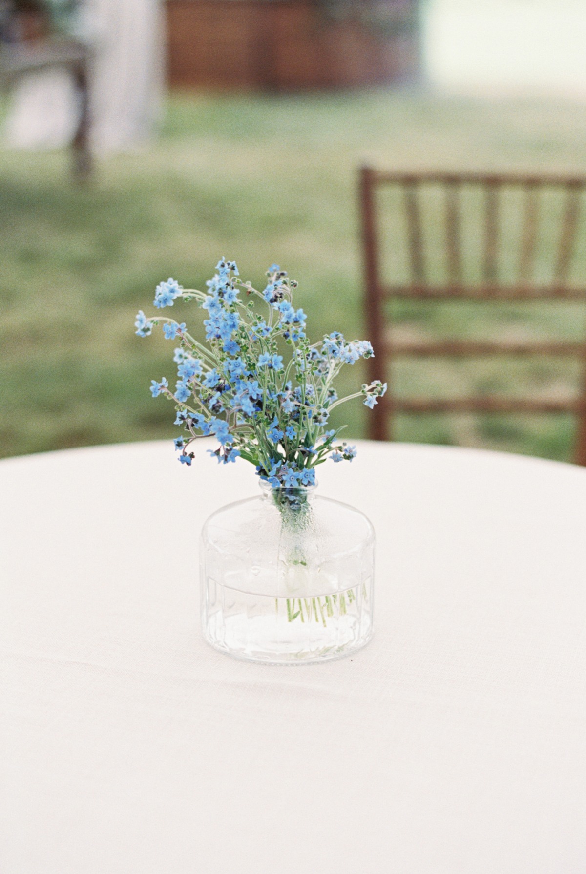 Blue wildflower stem bouquet for cocktail hour table 