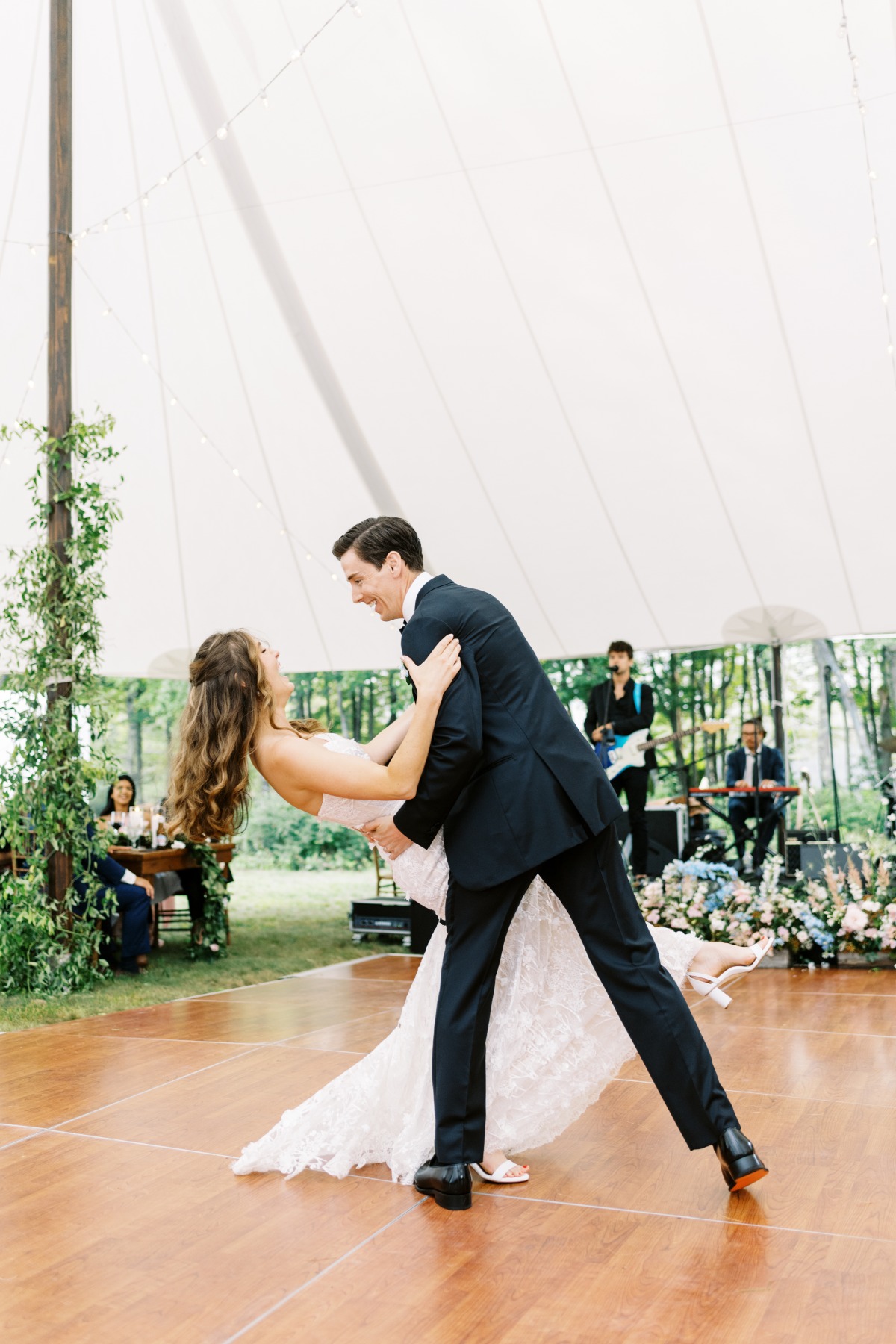 First dance dip at tented garden party wedding reception 