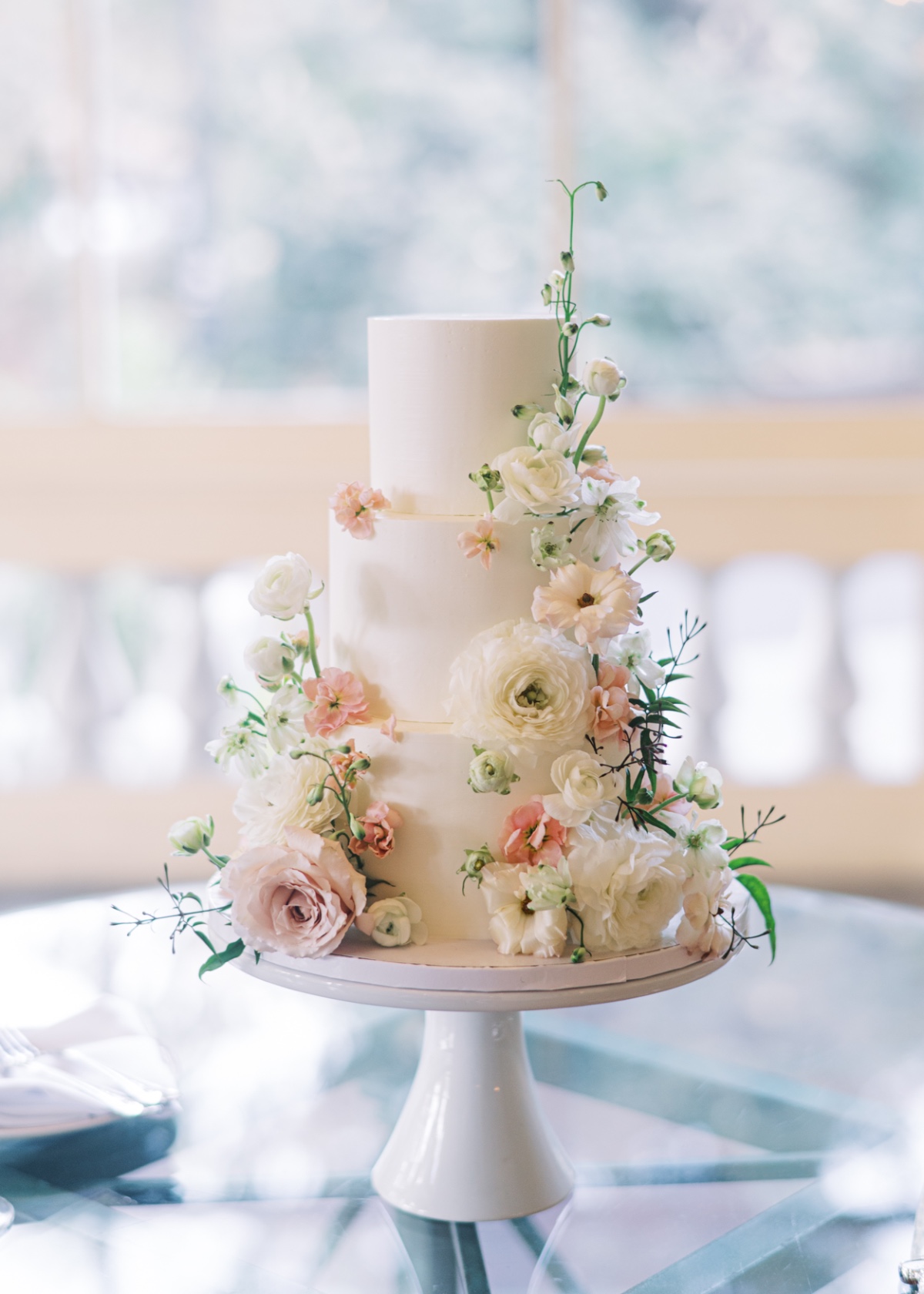 white and pink floral wedding cake