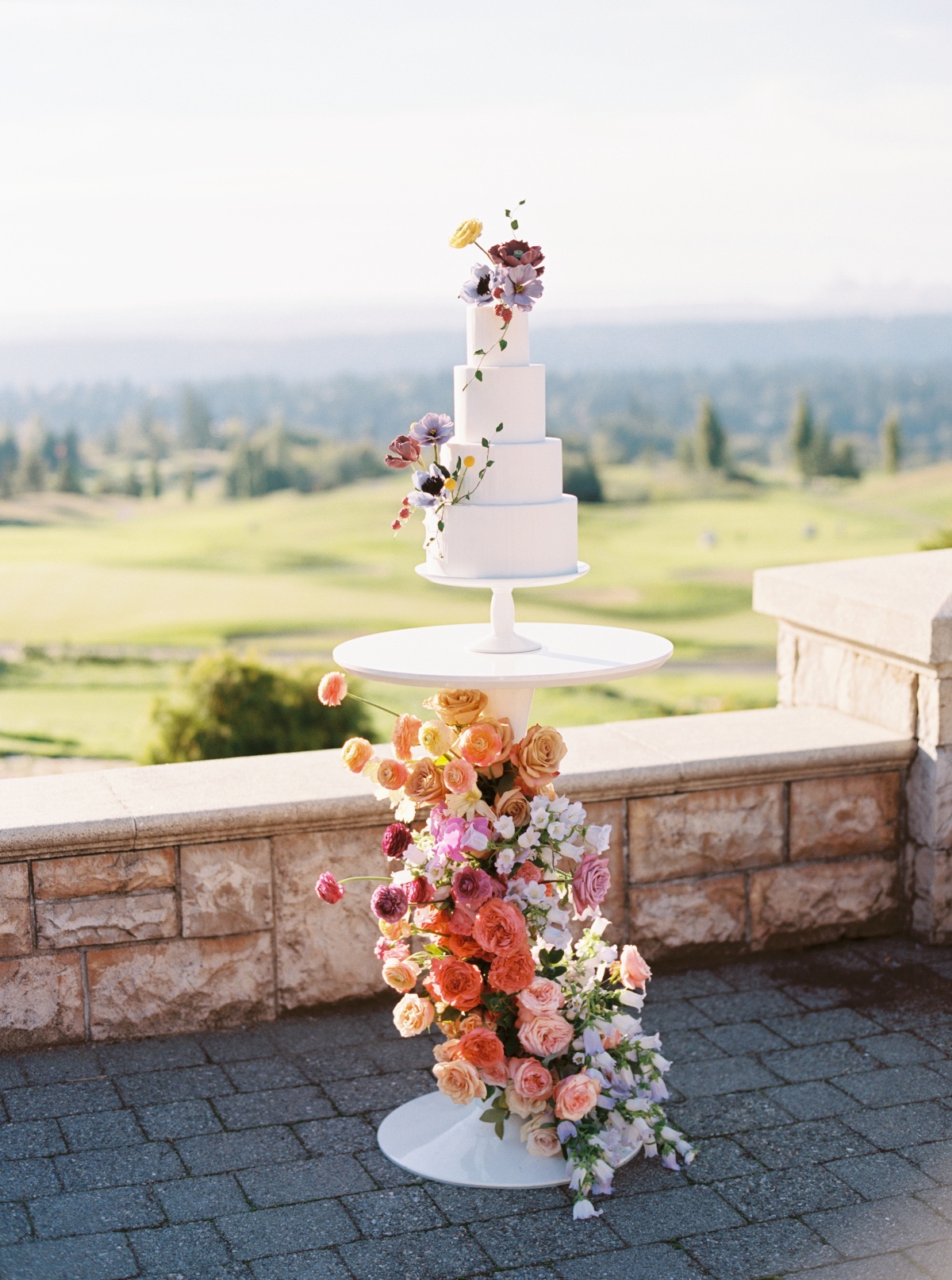 wedding cake table with climbing flowers