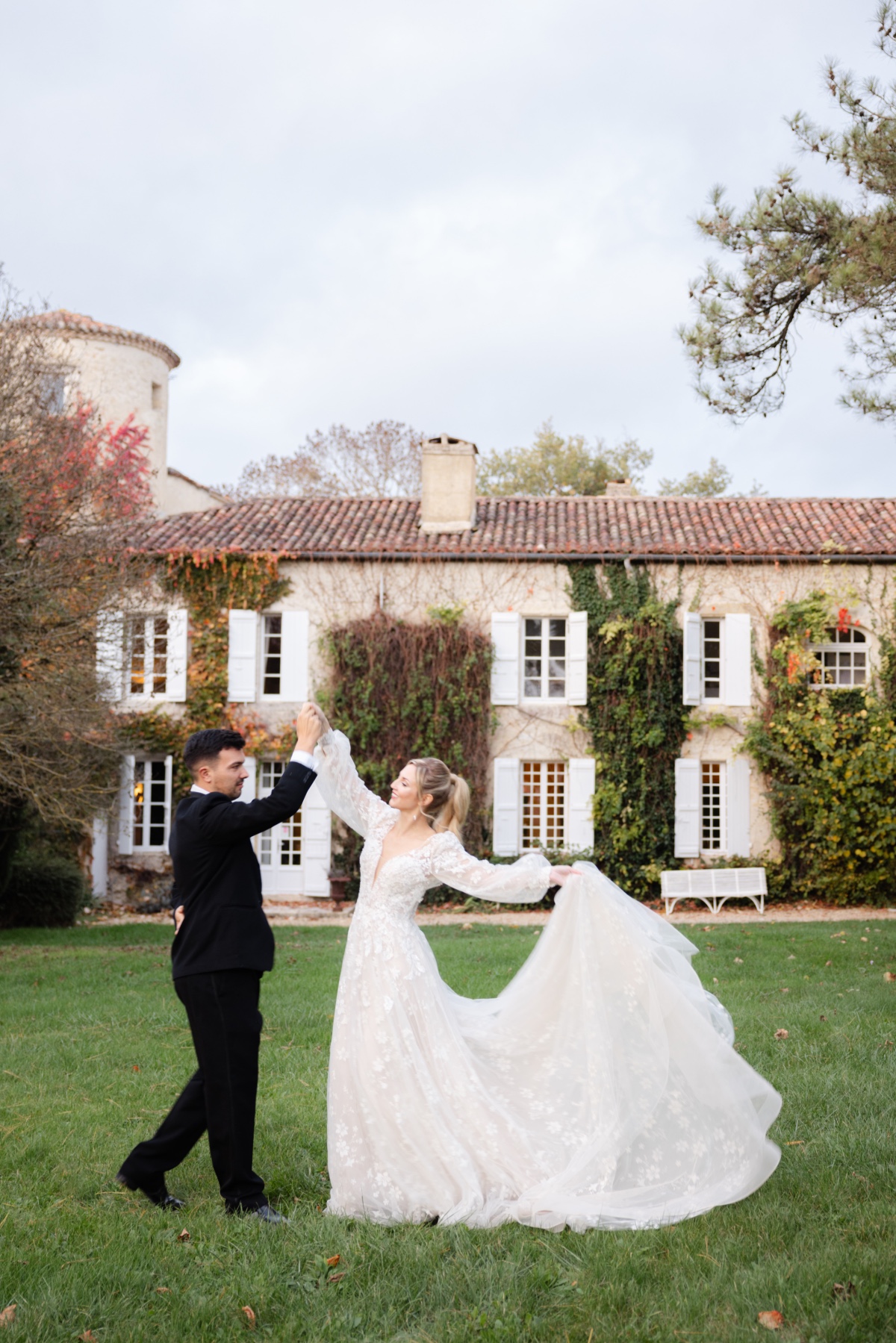 Dreamy French couple practicing first dance at French chateau