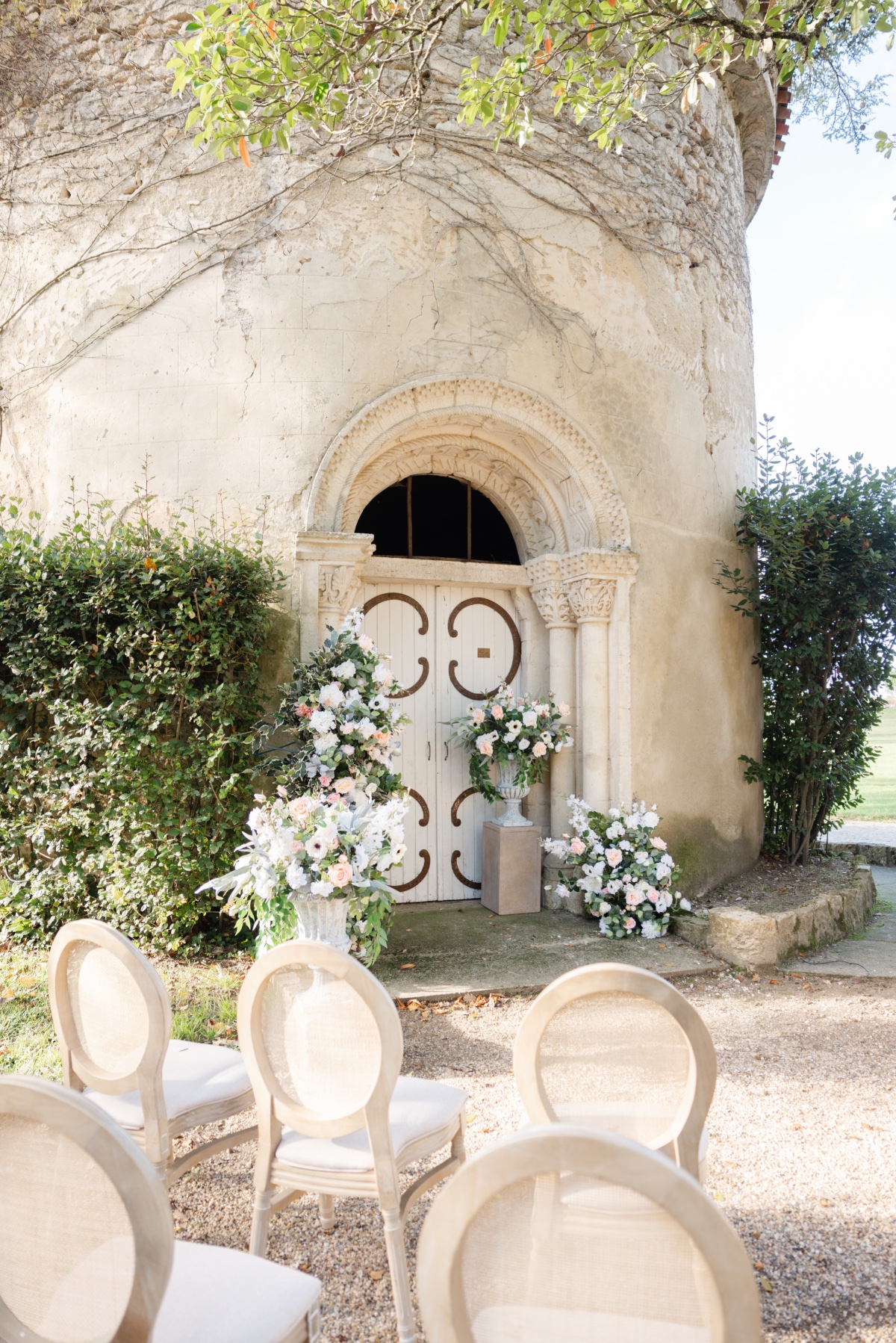 Timeless French chateau wedding ceremony inspo with flowers