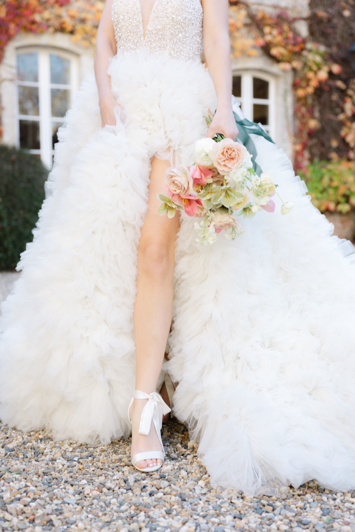 Demetrios wedding gown with ruffled tulle skirt and bow heels
