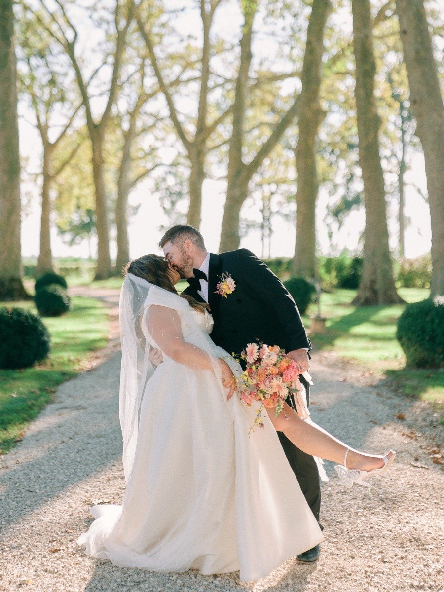A sun-kissed French chateau wedding in hues of pastel rainbow