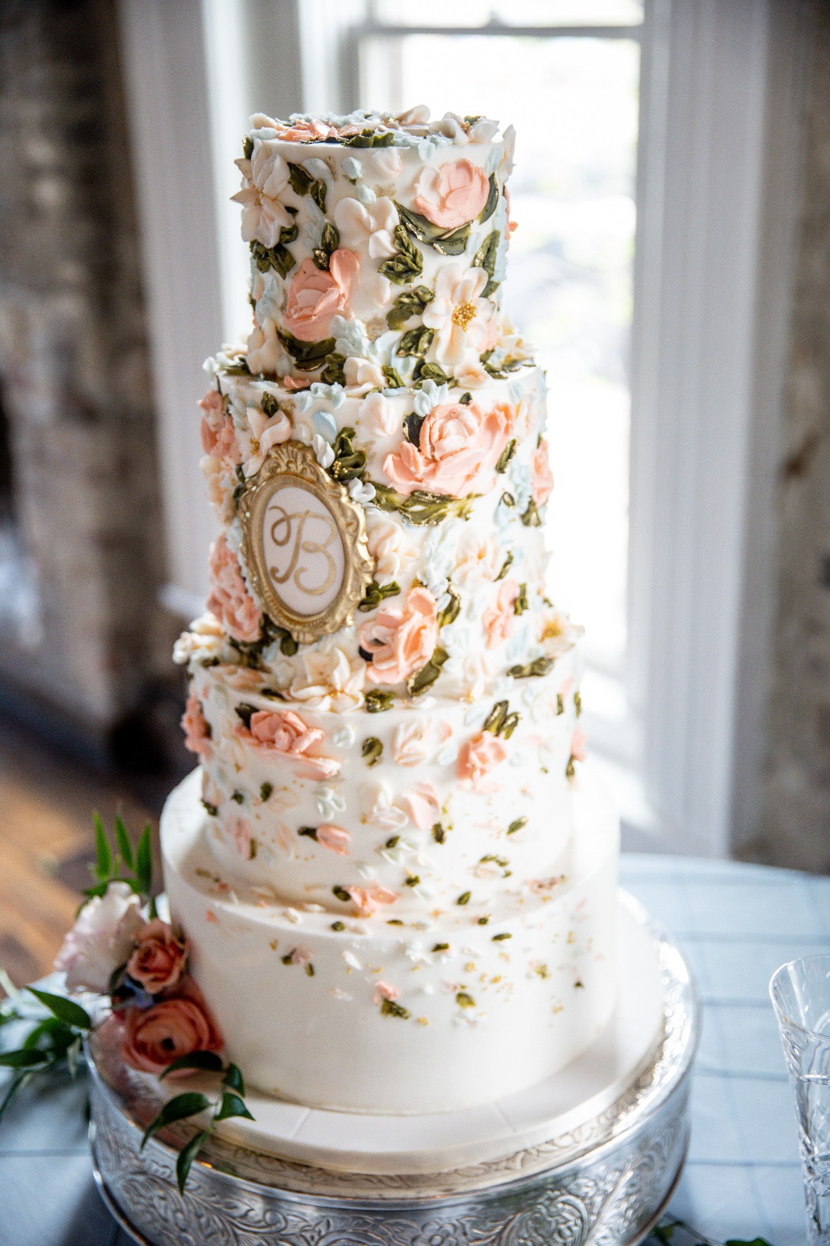 gold accented floral wedding cake