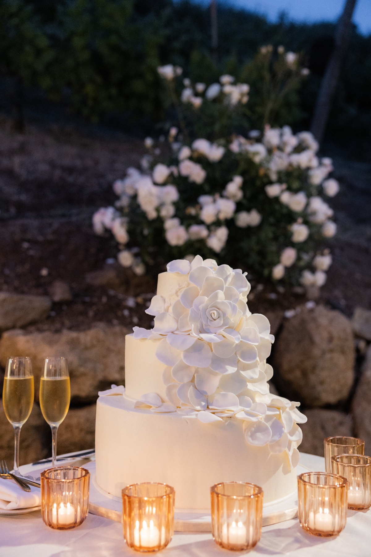 all white texted floral wedding cake