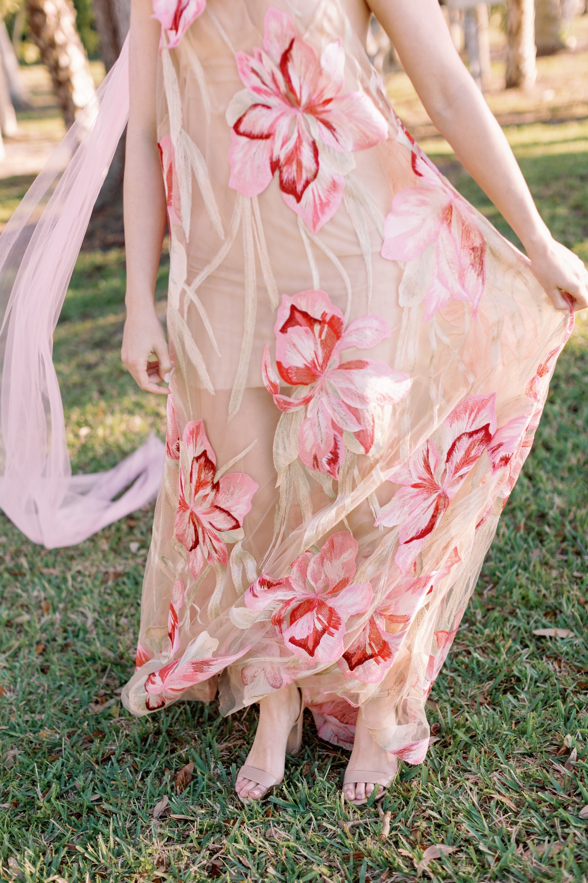 Pastel pink and red floral bridesmaid dresses with tulle