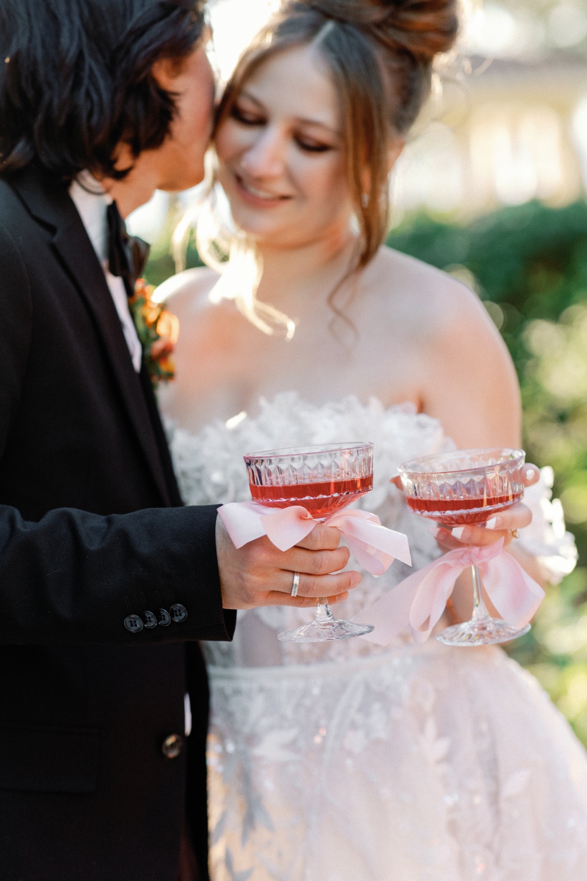 Bride and groom holding custom wedding cocktail hour drinks