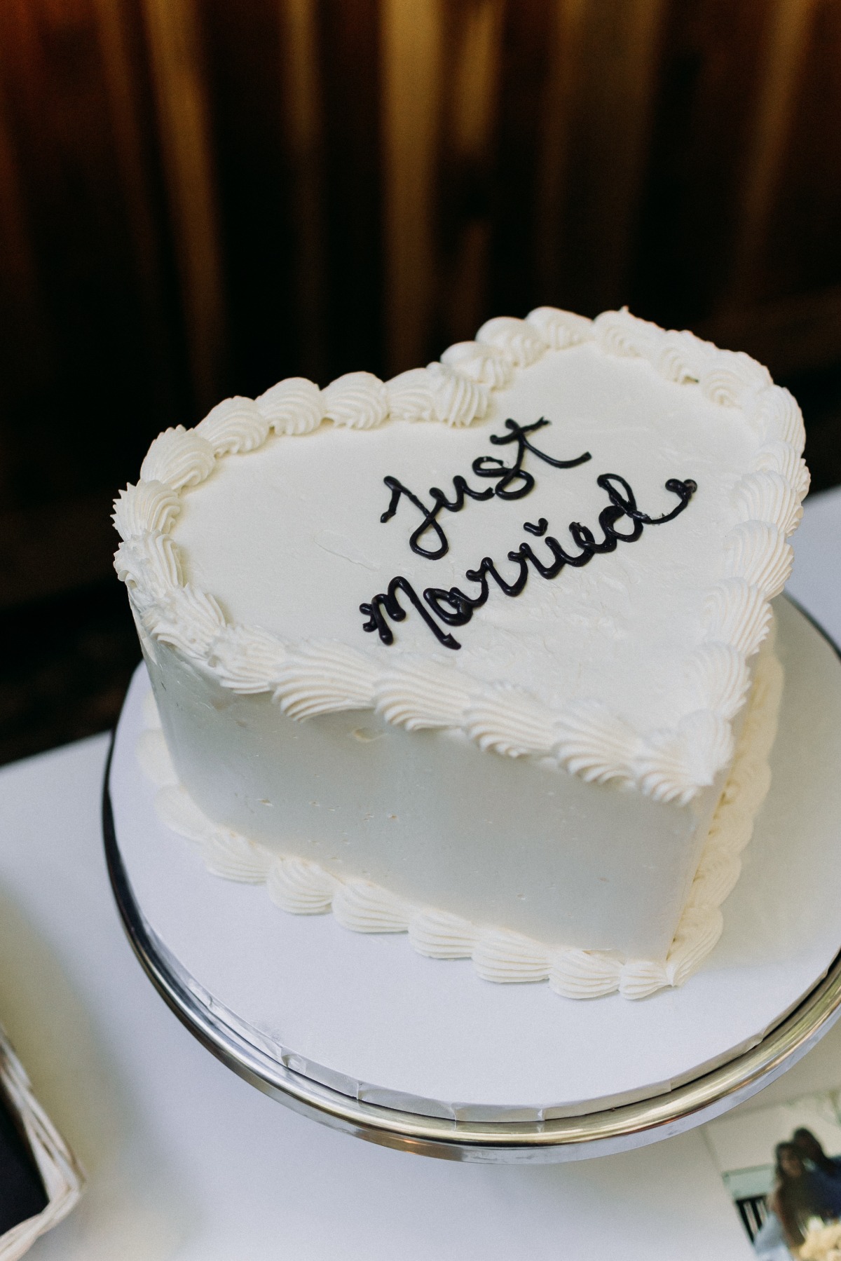 heart-shaped just married wedding cake