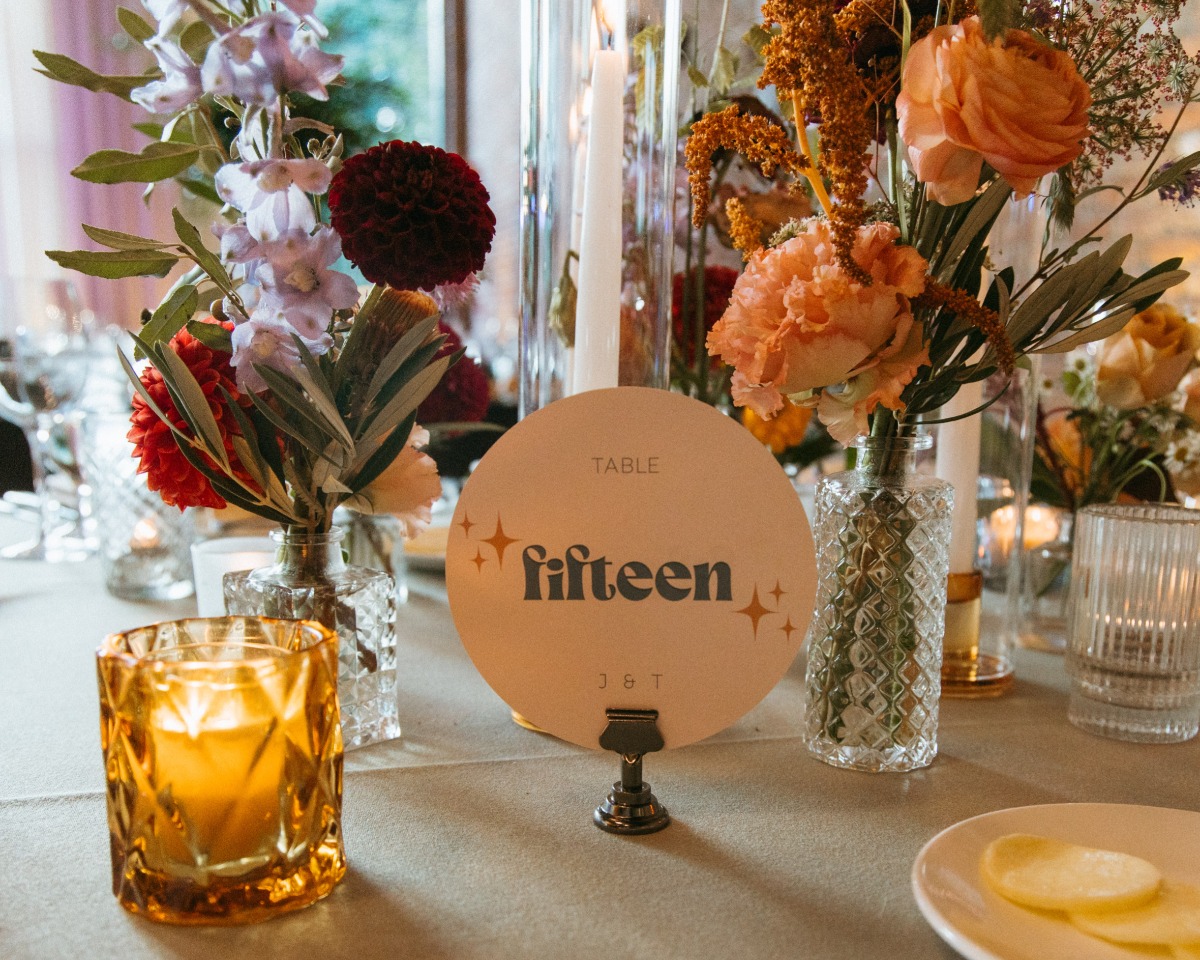 Modern circular table numbers with sparkles and metal clip