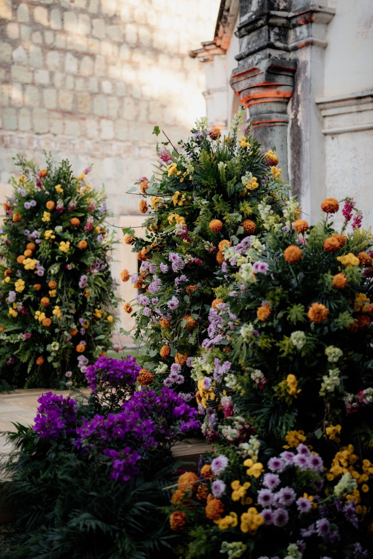 purple yellow and orange floral installations