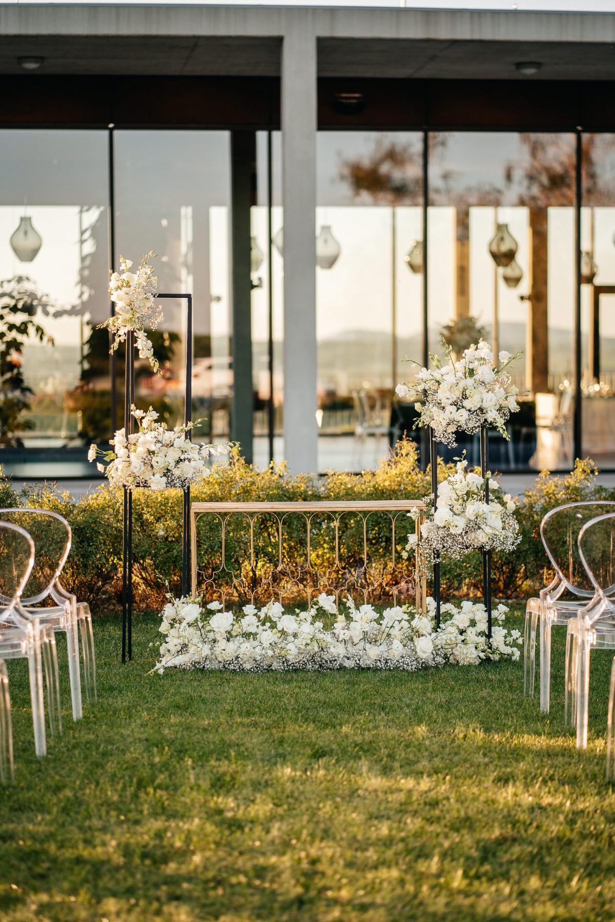 all-white wedding ceremony flowers