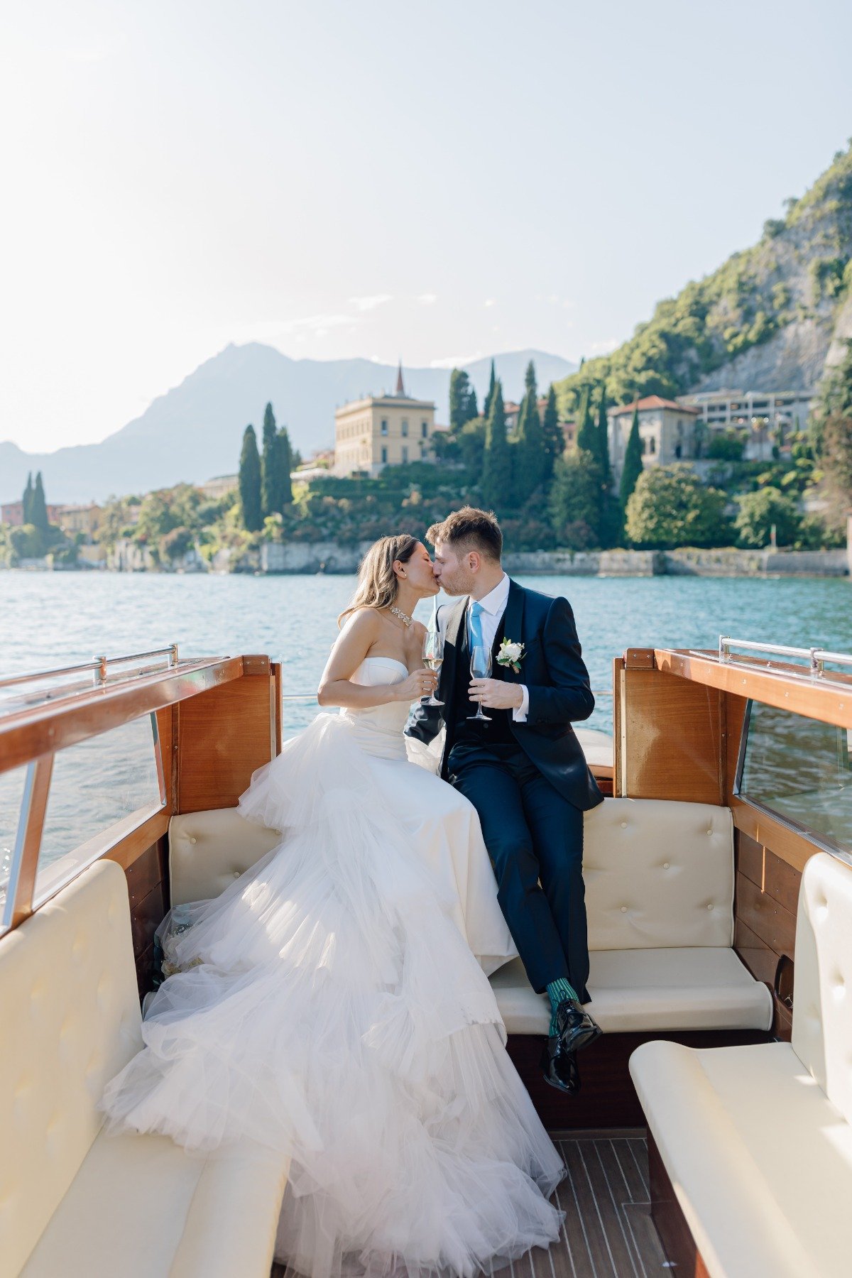 bride and groom on lake como water taxi