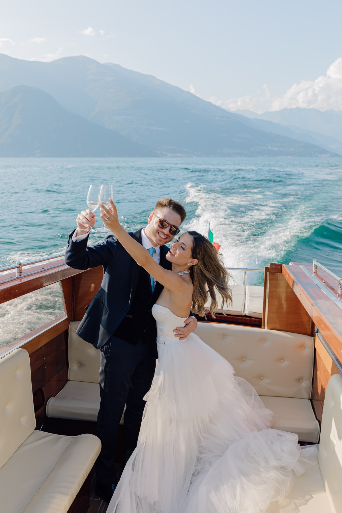 bride and groom on water taxi lake como