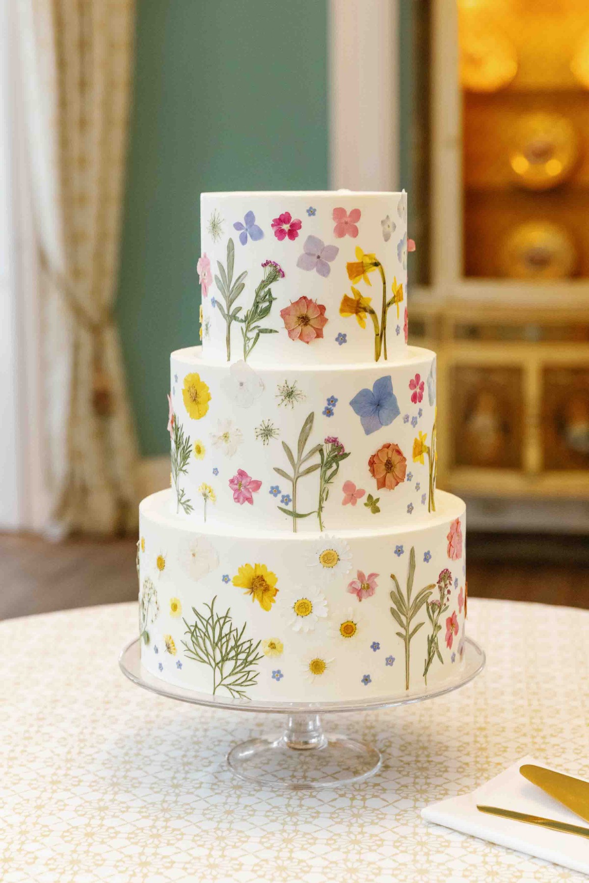 Dried floral wedding cake with colorful flower details