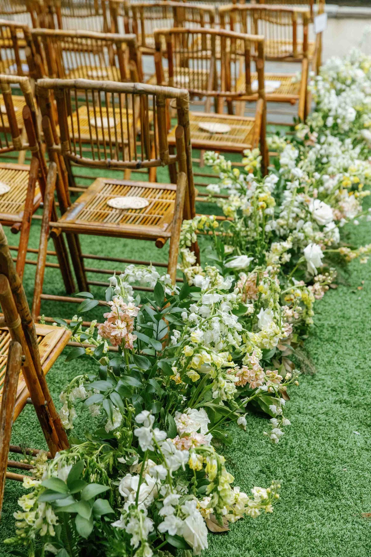 Elegant summer palette wedding ceremony aisle flowers 