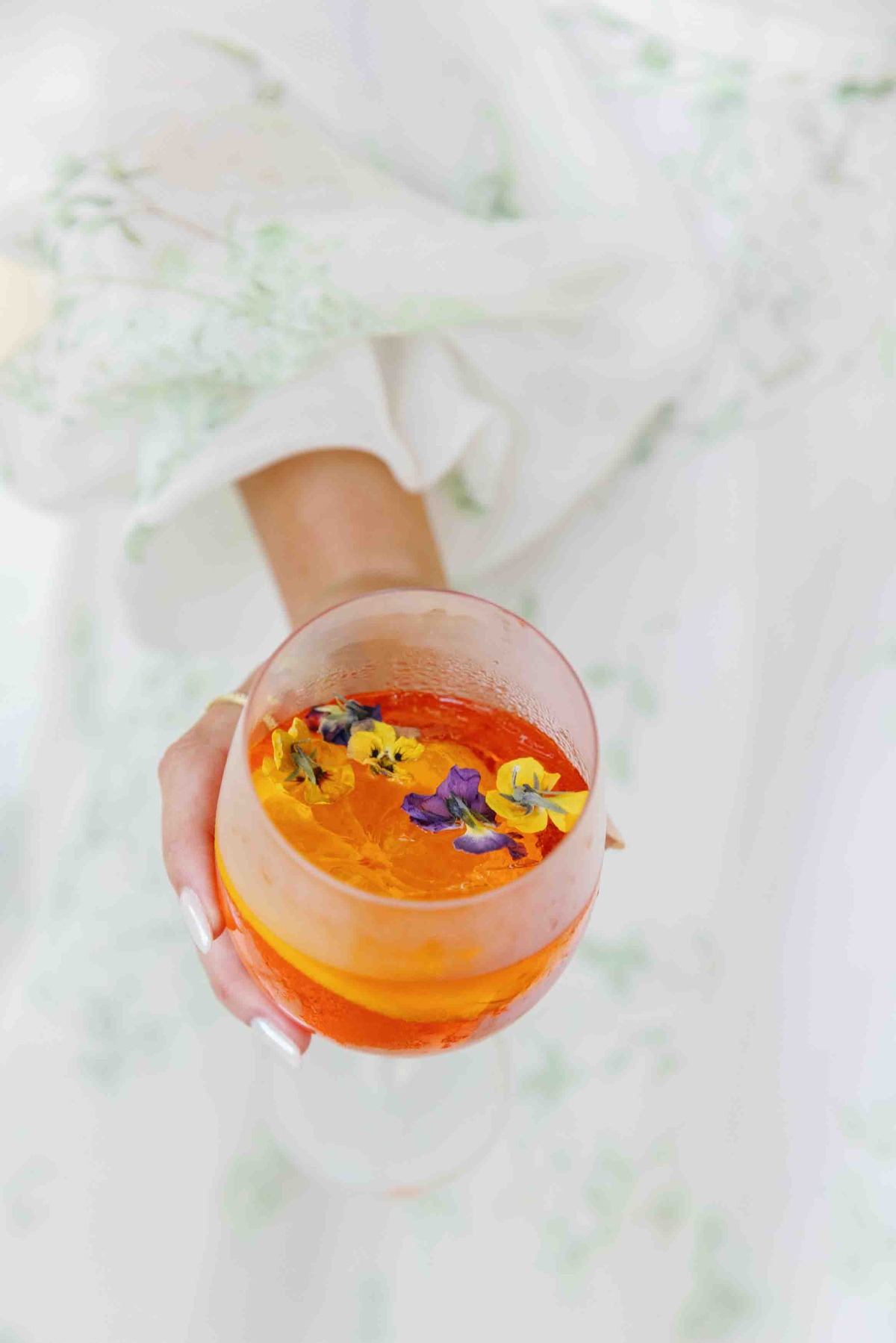 Custom wedding cocktails with edible floral toppers