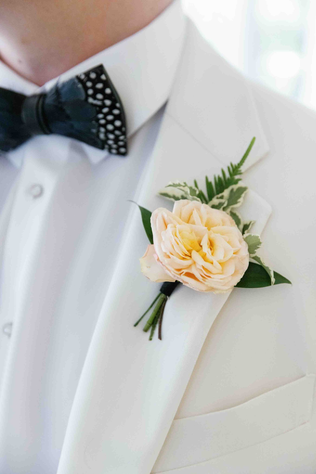 Charleston groom bow with feathers and classic boutonniere 